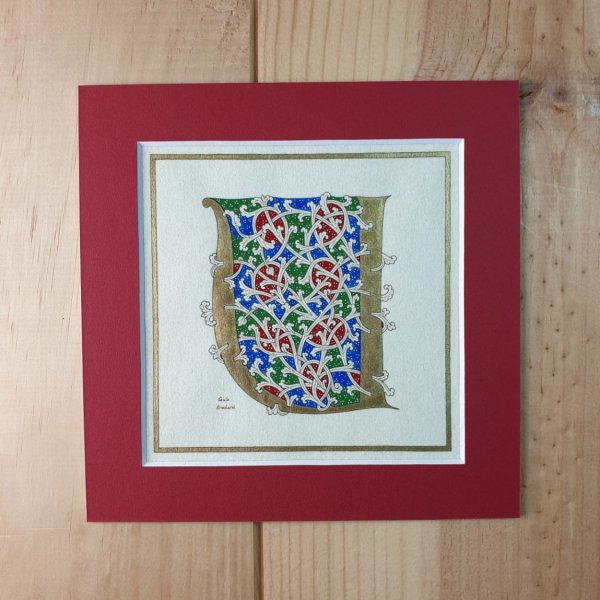 Letra U iluminada en estilo rom&aacute;nico