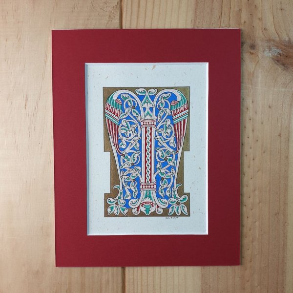 Letra M iluminada en estilo rom&aacute;nico