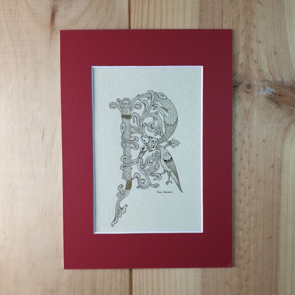 Letra R iluminada en estilo rom&aacute;nico