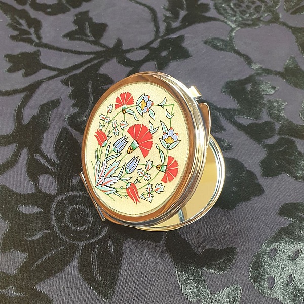 Miroir de sac rond avec enluminure florale ottomane.